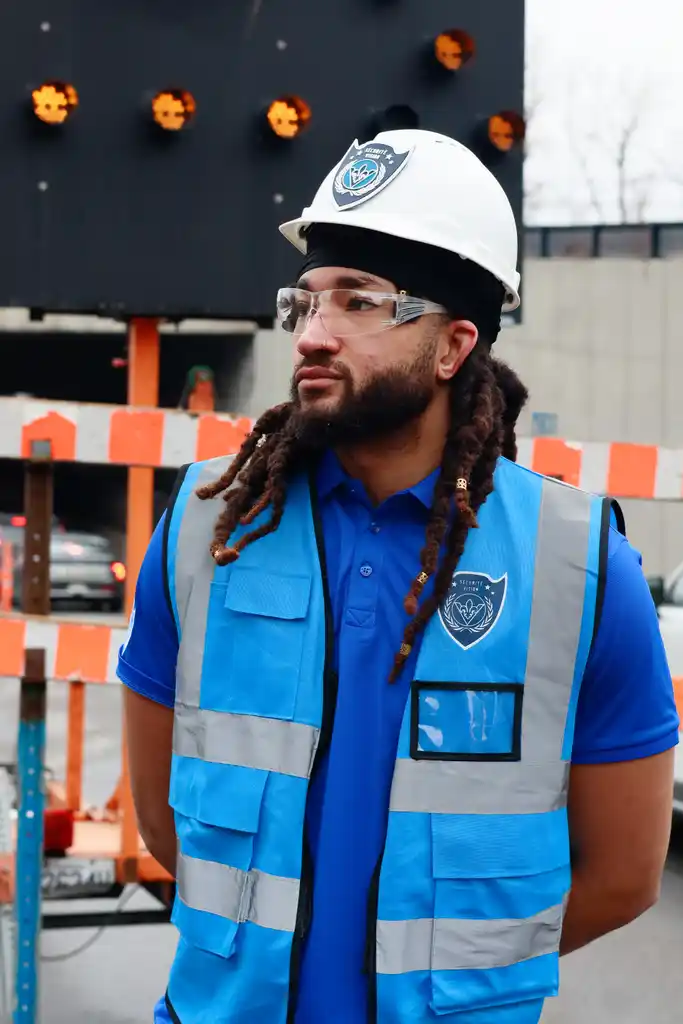 Guard verifying contractor access at a controlled site gate